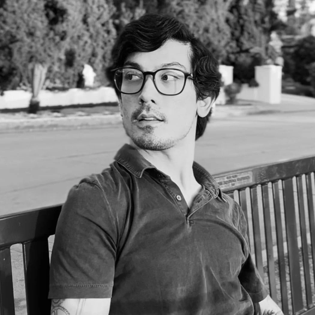 Ryan Minic sitting on a park bench